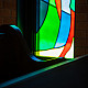 Sunlight bursts in all colors through the alluring panes of glass.