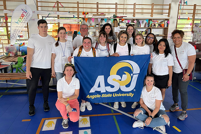 Felicia Garcia posing for a photo with friends in a Ukrainian refugee camp