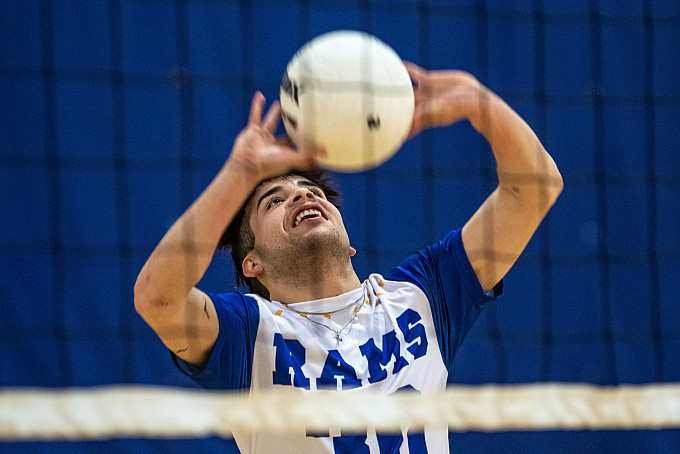 A student playing volleyball