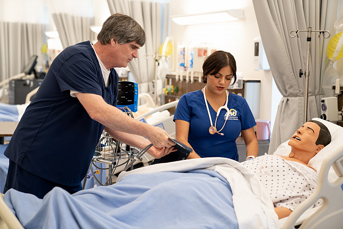 Beatrice practicing her nursing skills in the ASU skills lab.