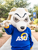 Roscoe posing on the mall while holding up the ram hand.