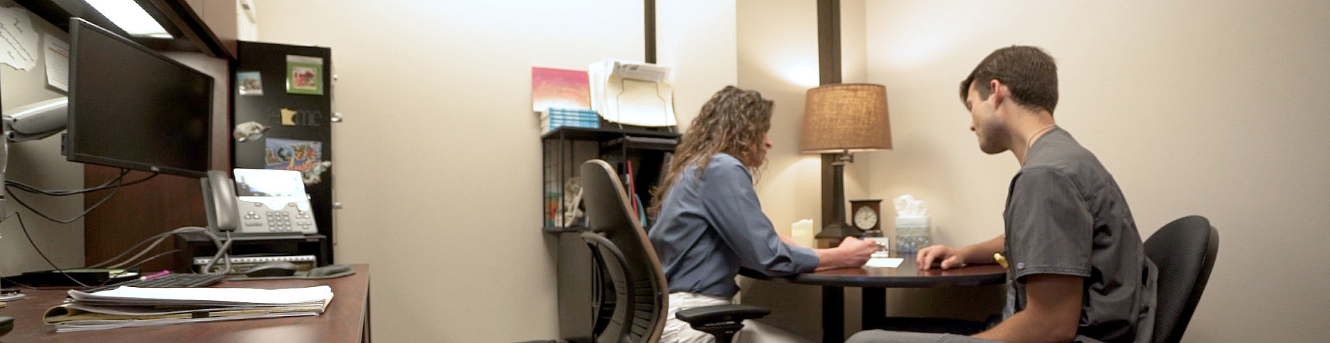 A Center for Career and Professional Services staff member working a student