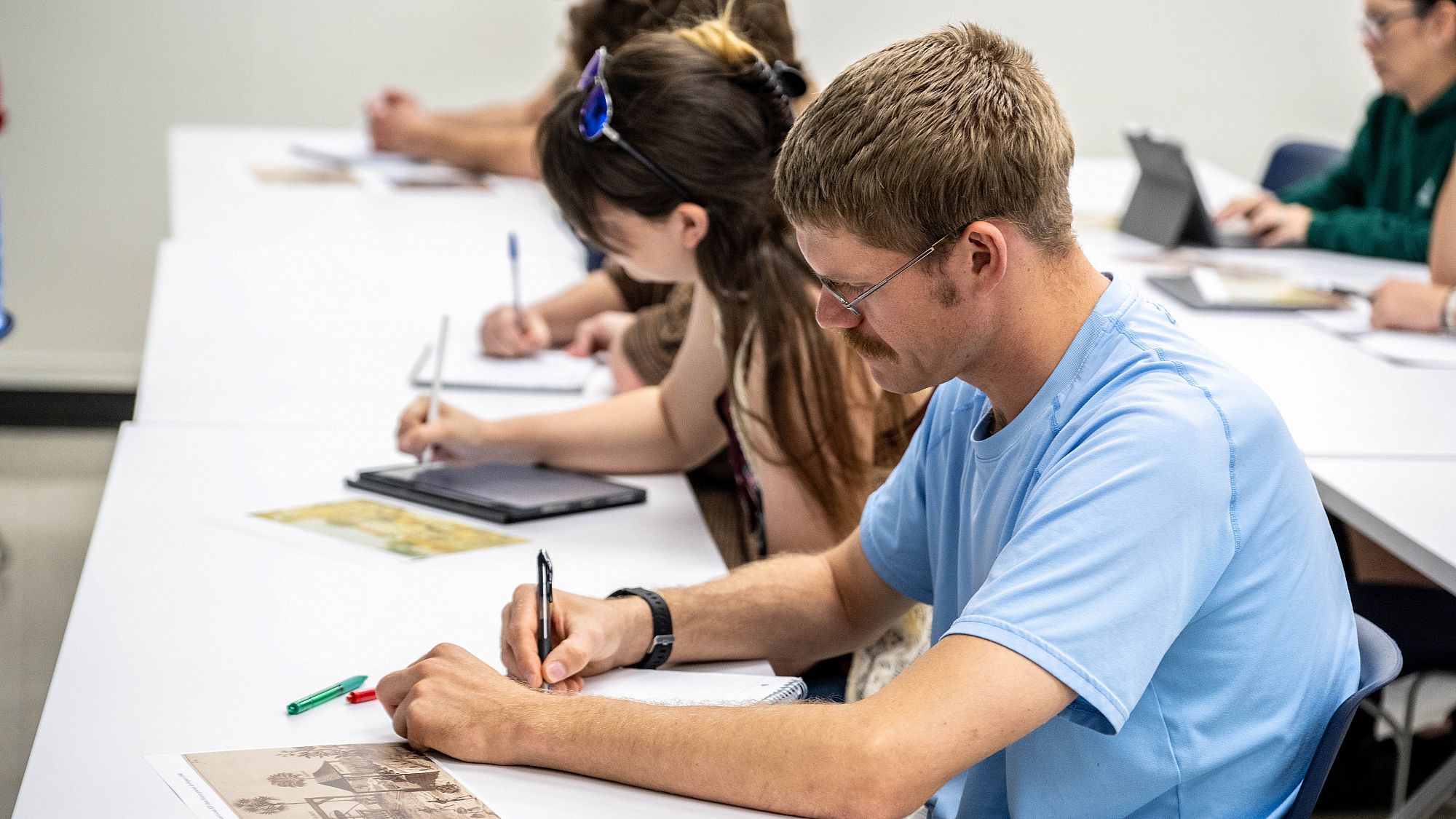 ASU history students taking notes.