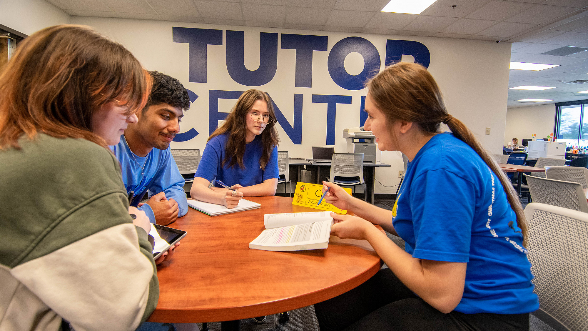 An Angelo State student tutoring other students.