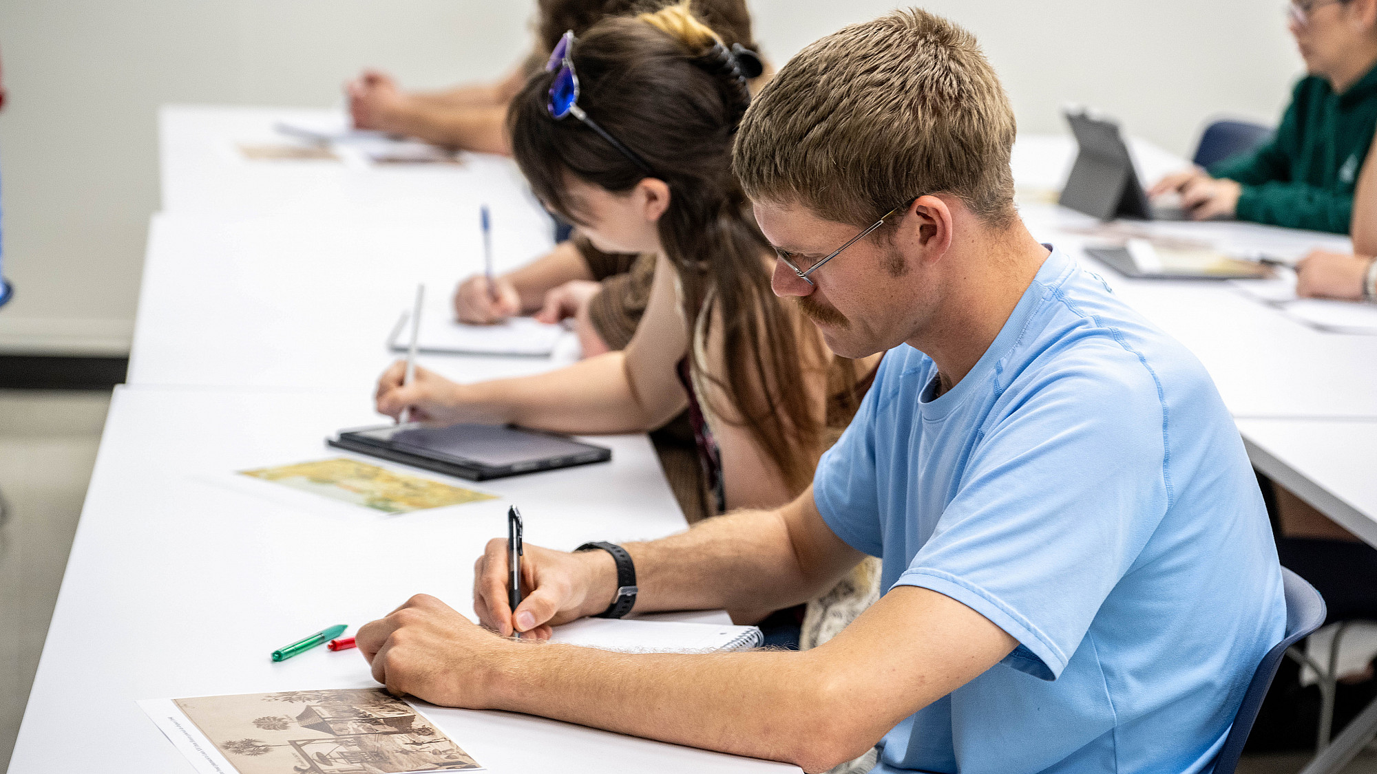 ASU history students taking notes.