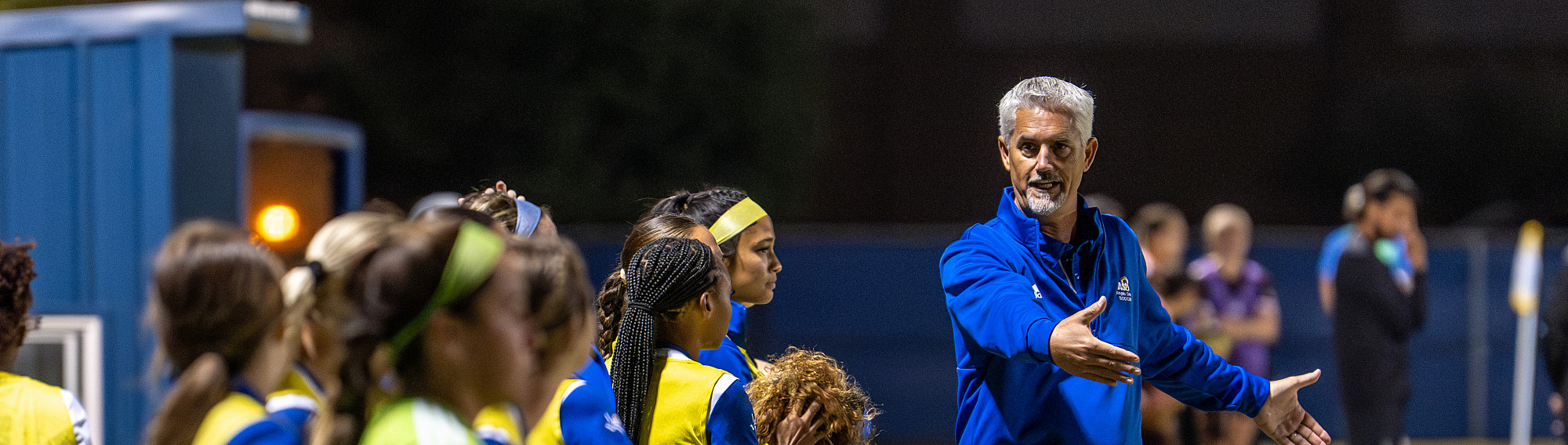Angelo State Rambells coach talking to his team.