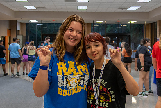 Rambunctious 7084 Students holding up the ram hands in University Center
