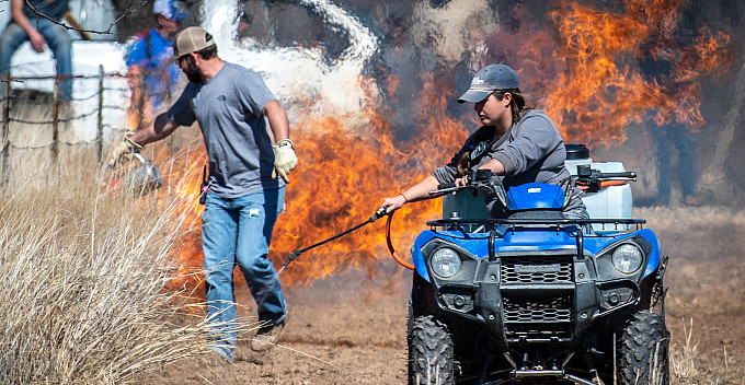 Students around control burn