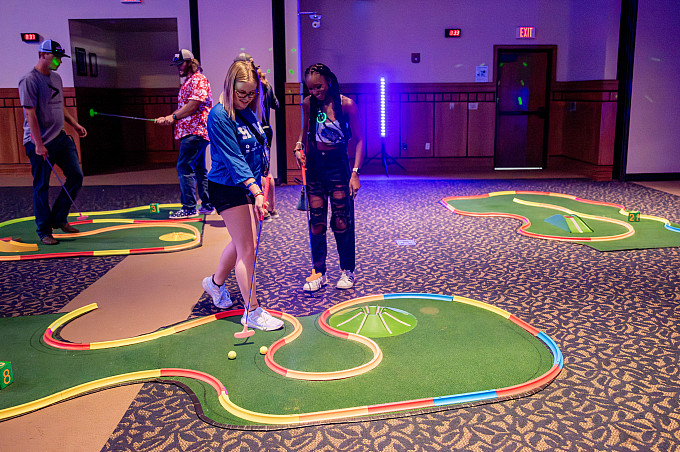 Students playing mini golf in the University Center