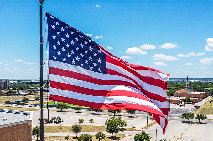 The American flag moving in the wind outside the Junell Center