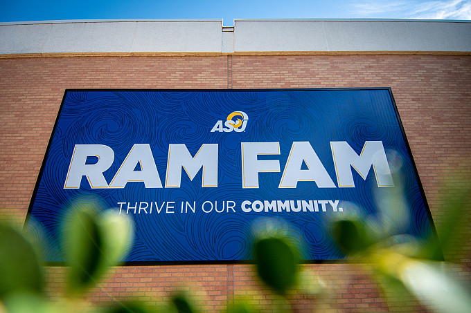 A big banner on a building that says Ram Fam