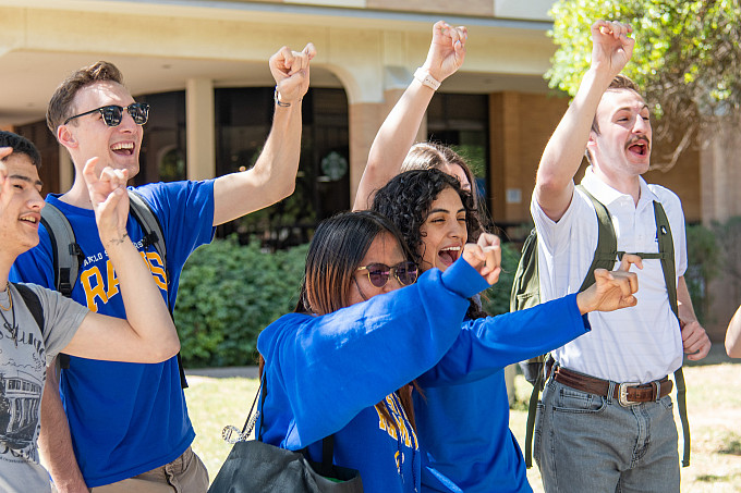 Honors Program 9605 A group photo of ASU honors holding up the Ram Hand.