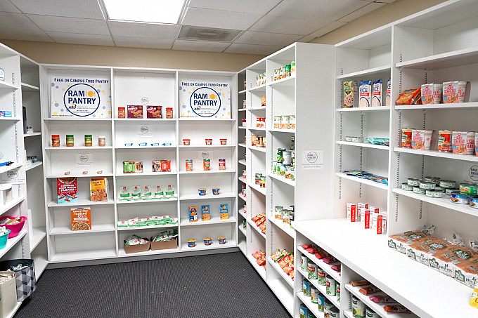 Non-perishable food items on white shelves in the Angelo State Ram Pantry