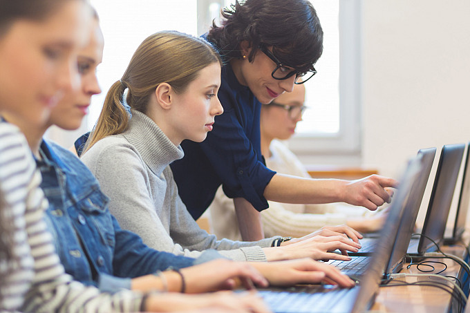 Students working in a computer science class