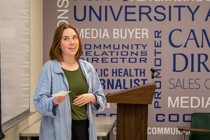 A student giving a presentation to the class