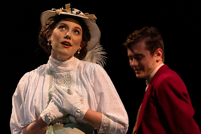 Students performing a play on stage