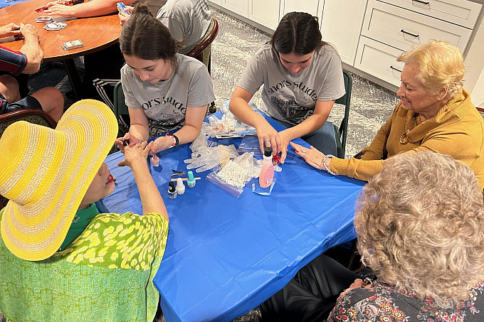 Two ASU Honors students volunteering at Baptist Retirement Community.