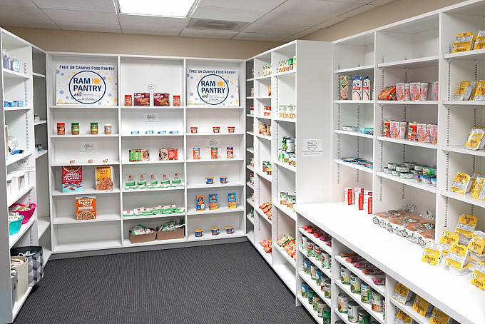 Non-perishable food items on white shelves in the Angelo State Ram Pantry