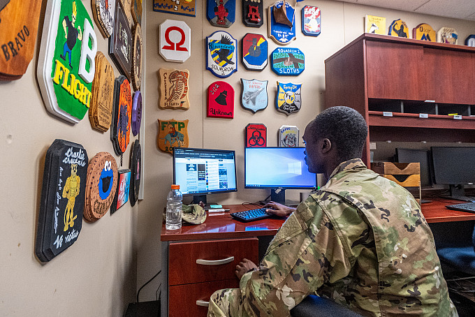 An ASU ROTC cadet working on his computer.