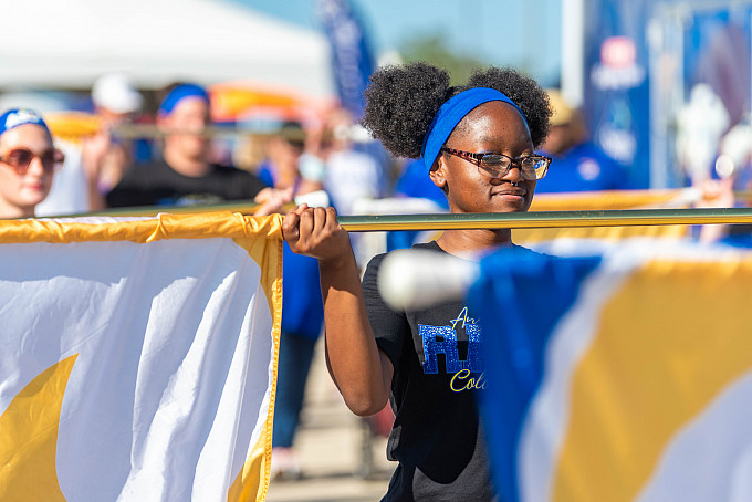 ASU color guard walks through pre-game tailgate party