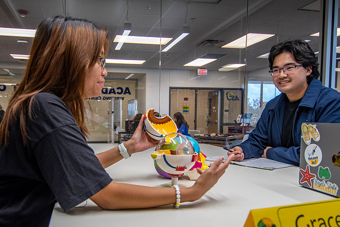 An Angelo State student tutoring other students.