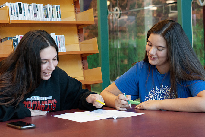 An ASU Honors student tutoring a student apart of the WHIT program.