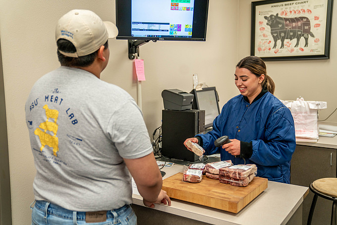 A student working in the Meat Market at the MIR Center