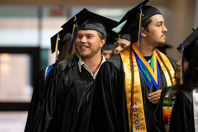 Students walking to their seats at graduation