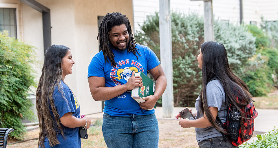 Students in Fostering Ram Success program talking with each other