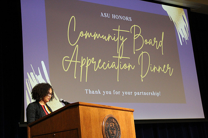 An Honors student standing in front of a podium at the ASU Honors Community Board Appreciation Dinner